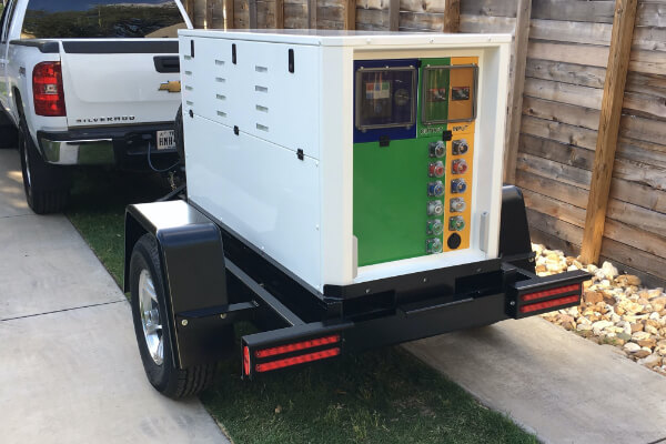 Portable generator in Texas being hauled by a pickup truck