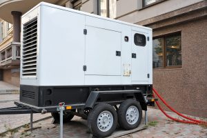 Mobile electric generator with power cable on street