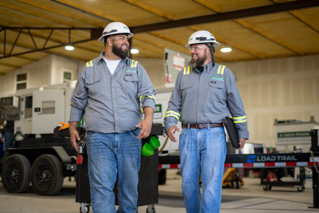 JC Davis Power crew standing beside temporary power equipment